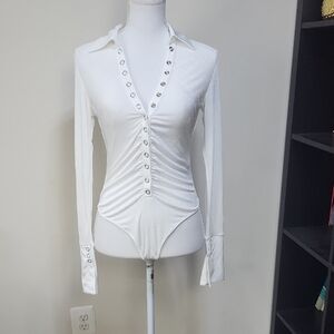 ATOIR The Palmer Bodysuit In White Snap Down Front Long Cuffed Sleeves